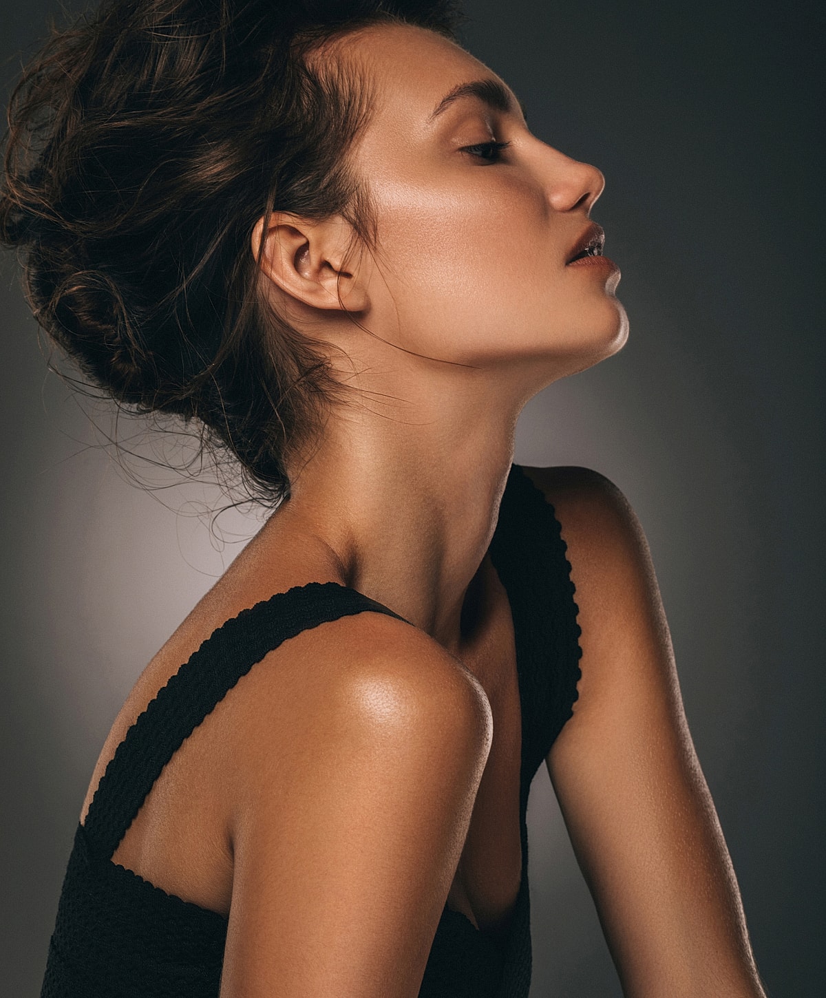 Profile of a woman with elegant hairstyle.