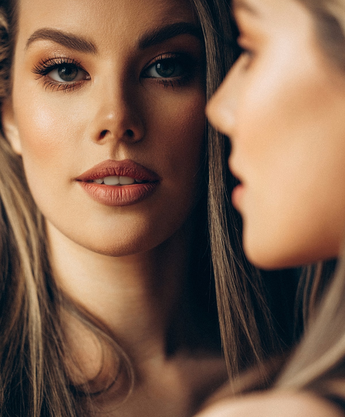 Two women sharing a moment, close-up portrait.