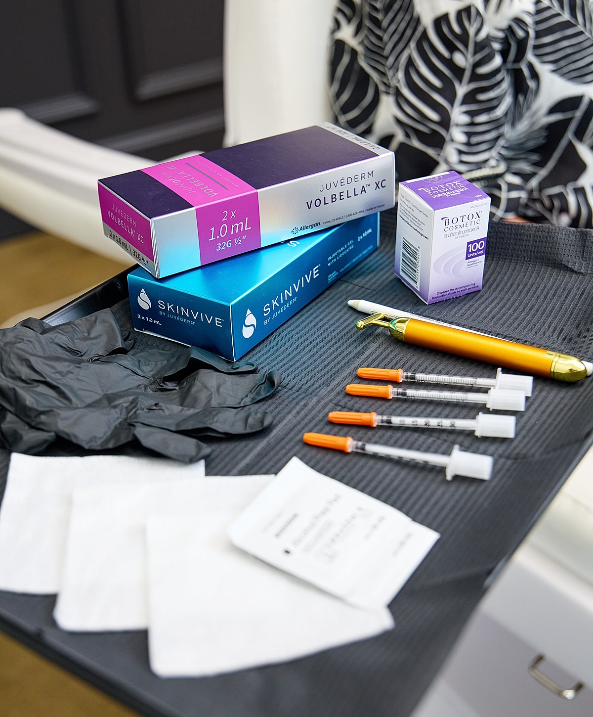 Cosmetic treatment supplies on a medical tray.