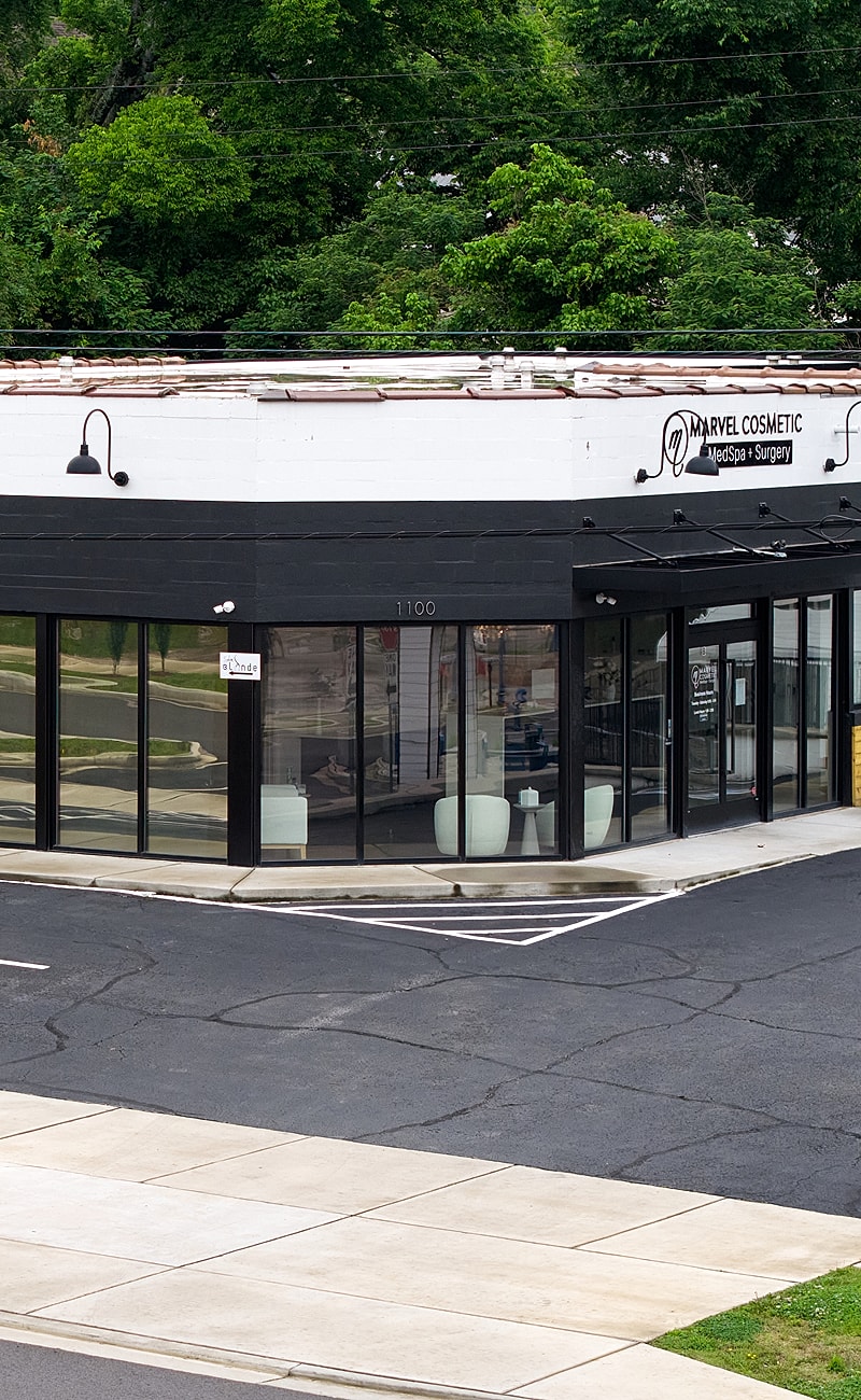 Cosmetic surgery clinic with large glass windows.