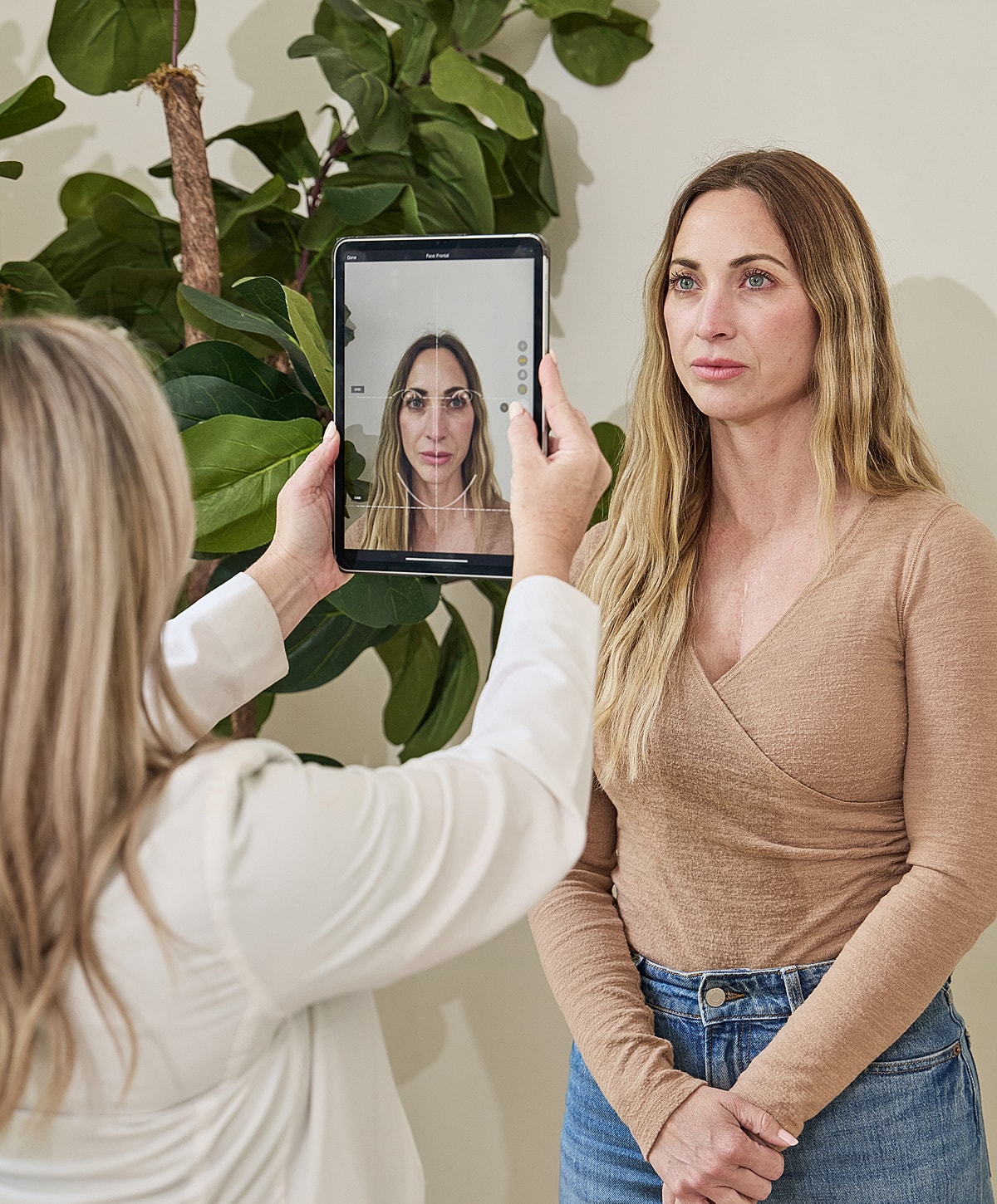 Close-up of model with glowing skin and freckles.
