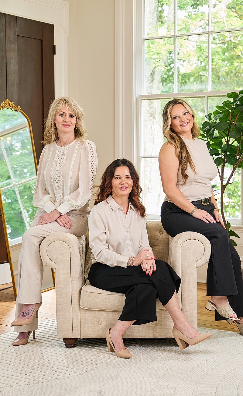 Historic white mansion with columns and pathway.