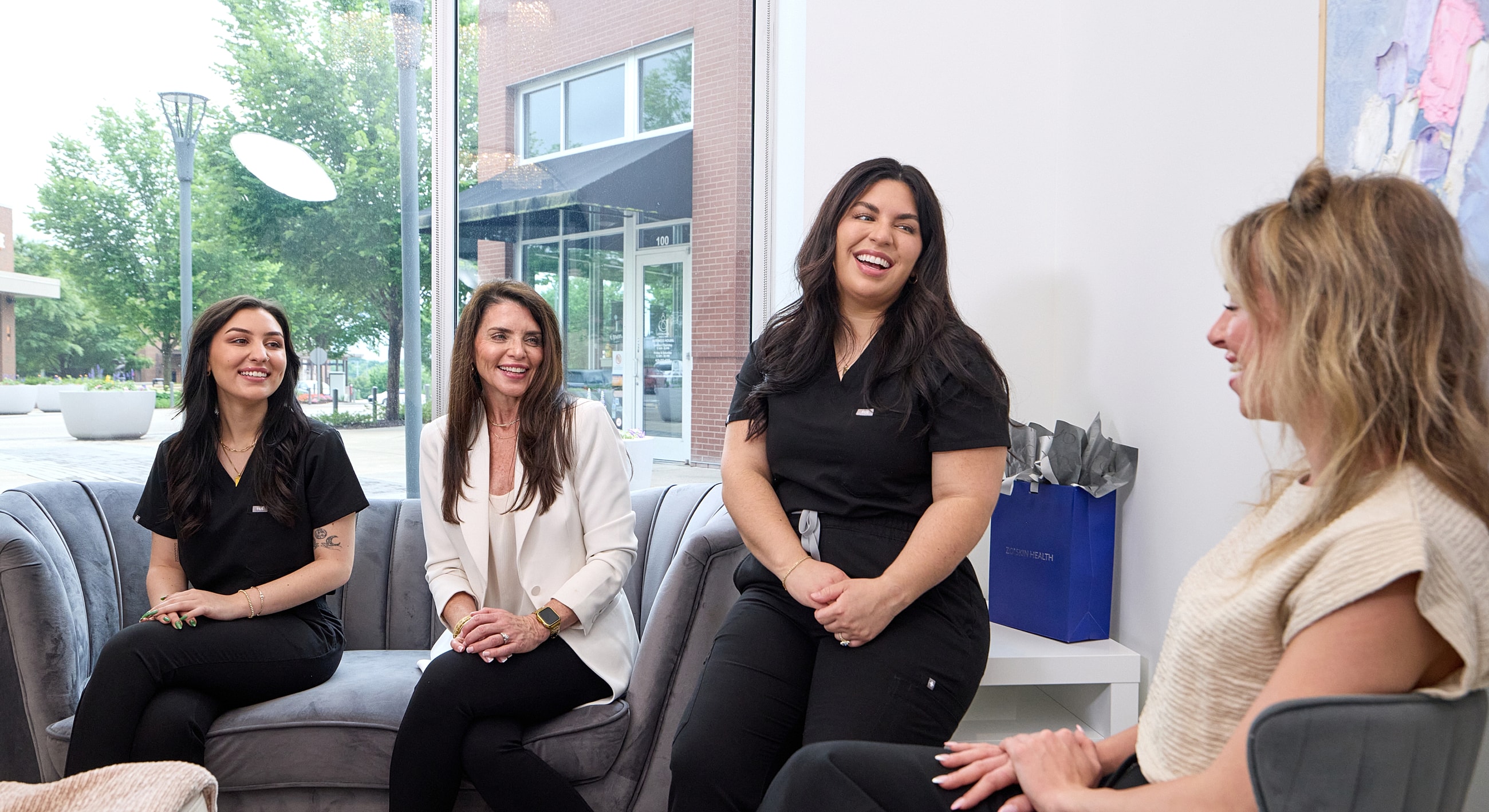 Healthcare professionals chatting in a modern setting.