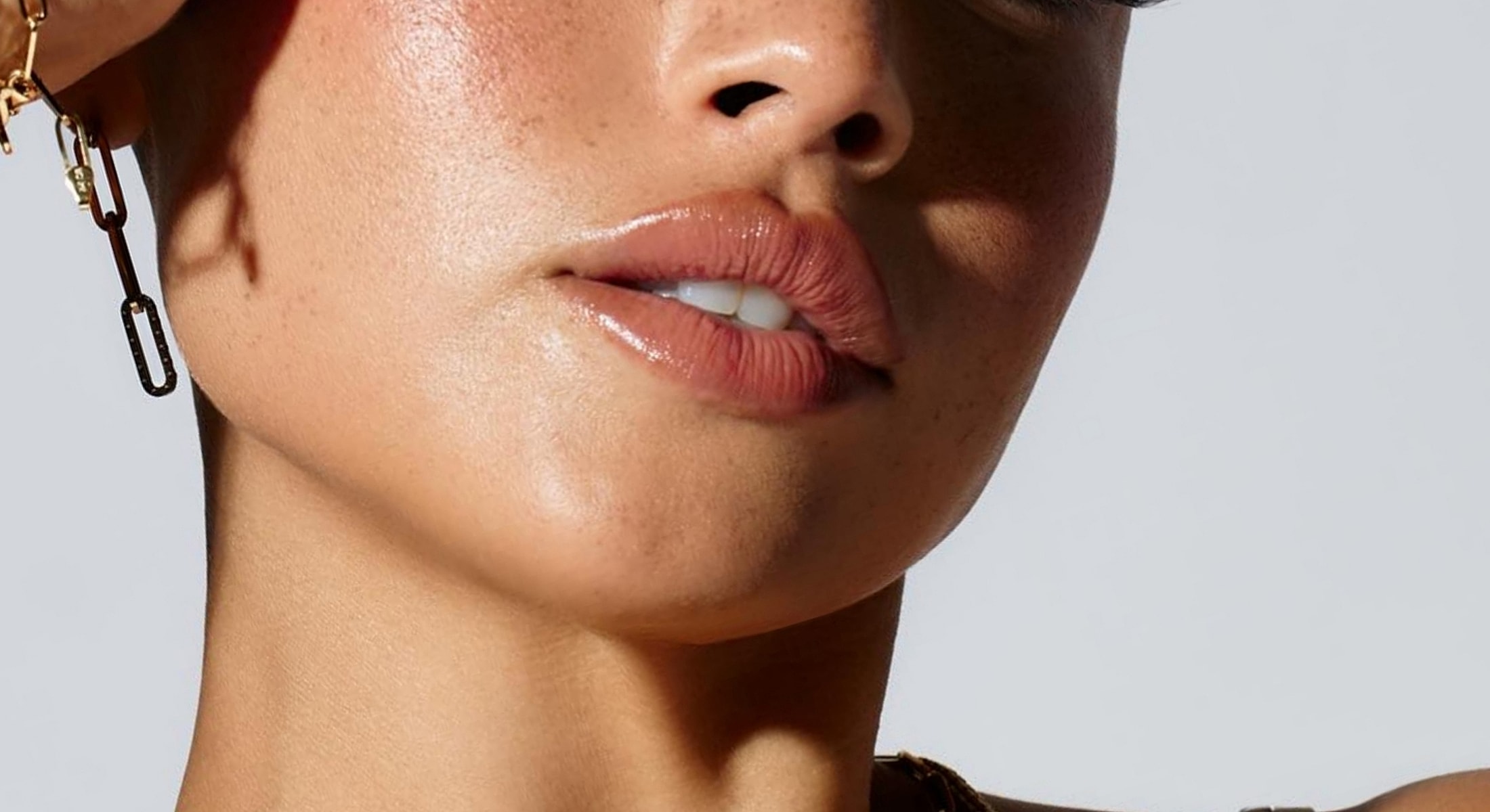 Close-up of lips and skin details.