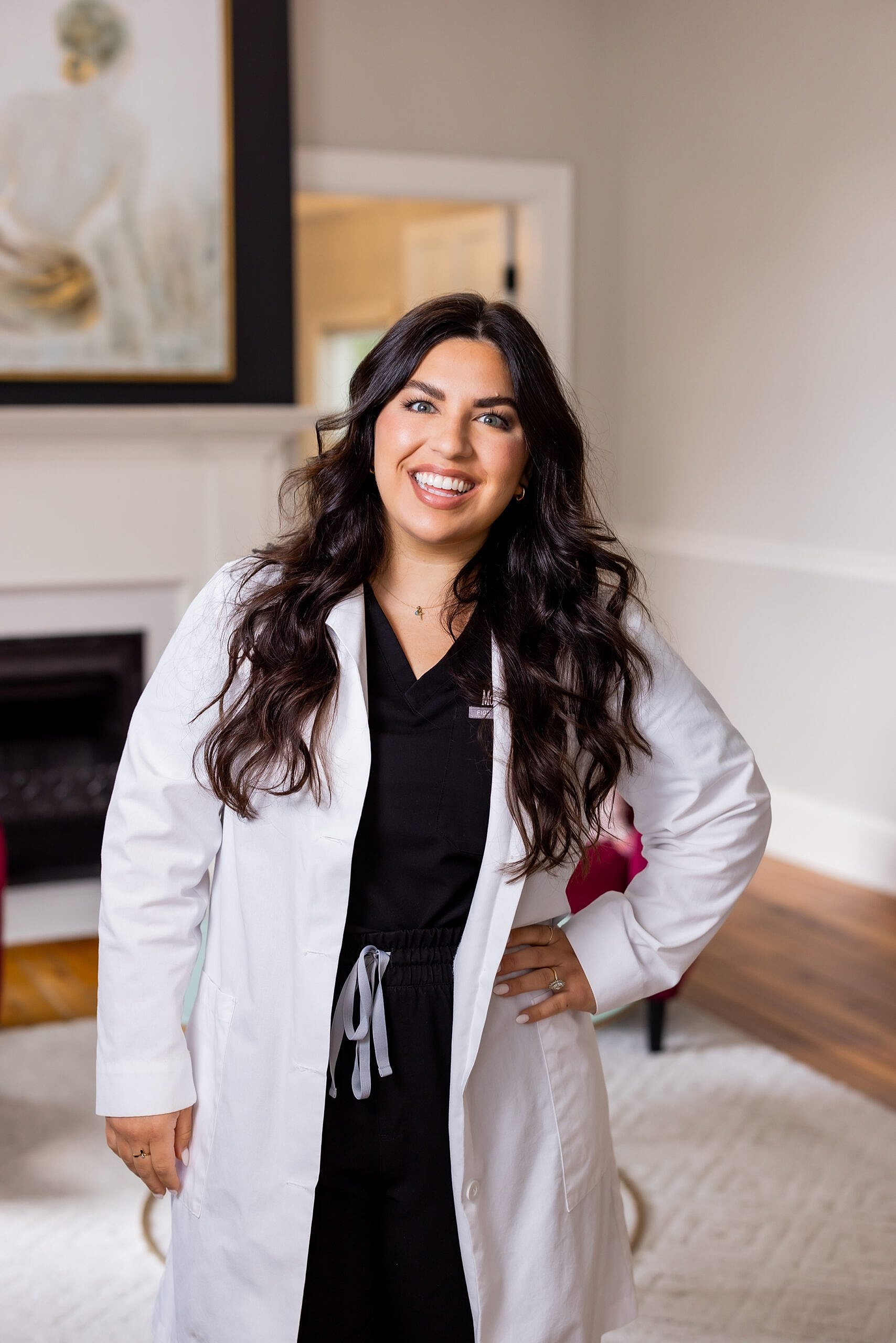 Smiling medical professional in white lab coat.