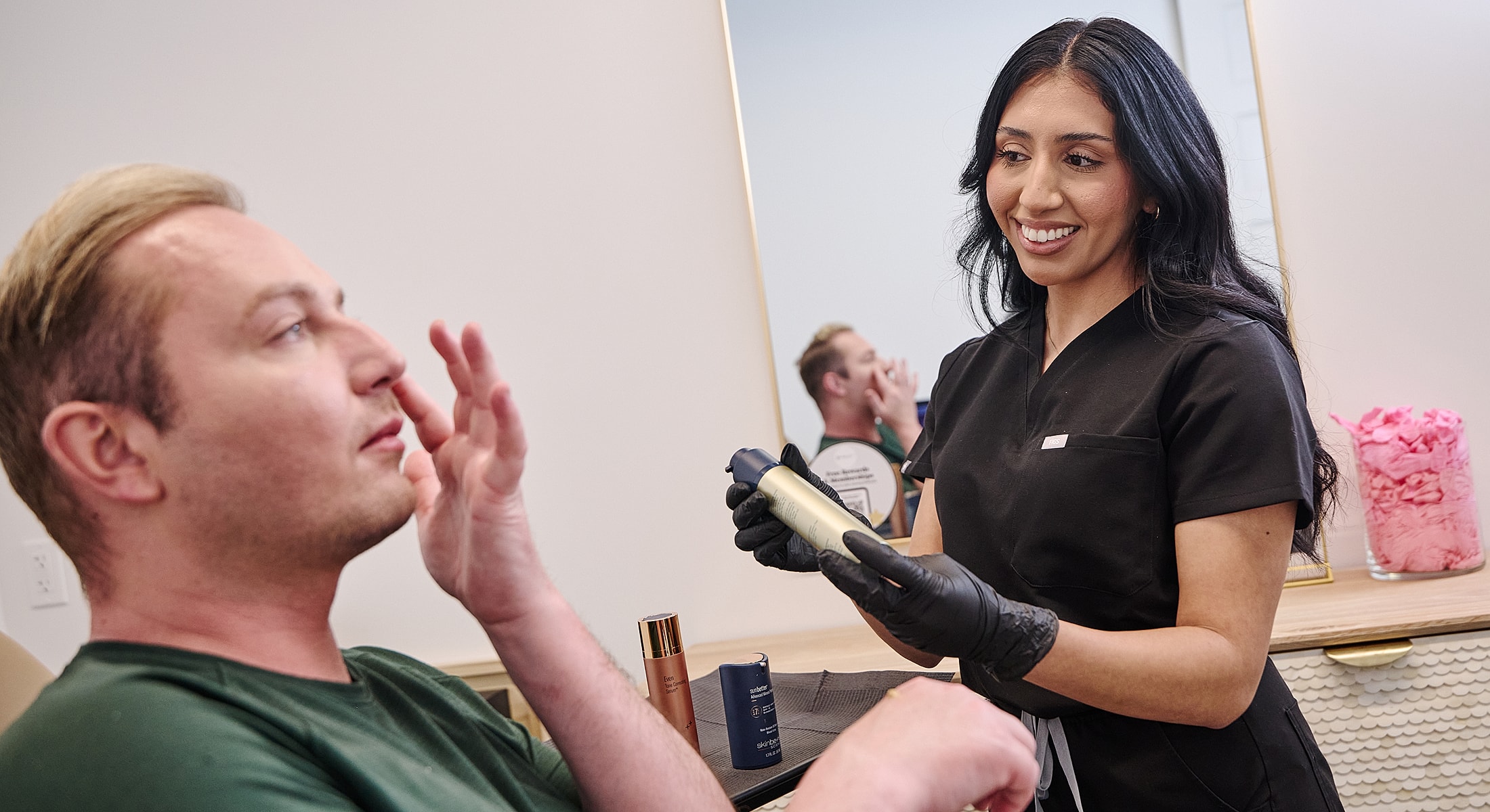 Skincare consultation between client and professional.