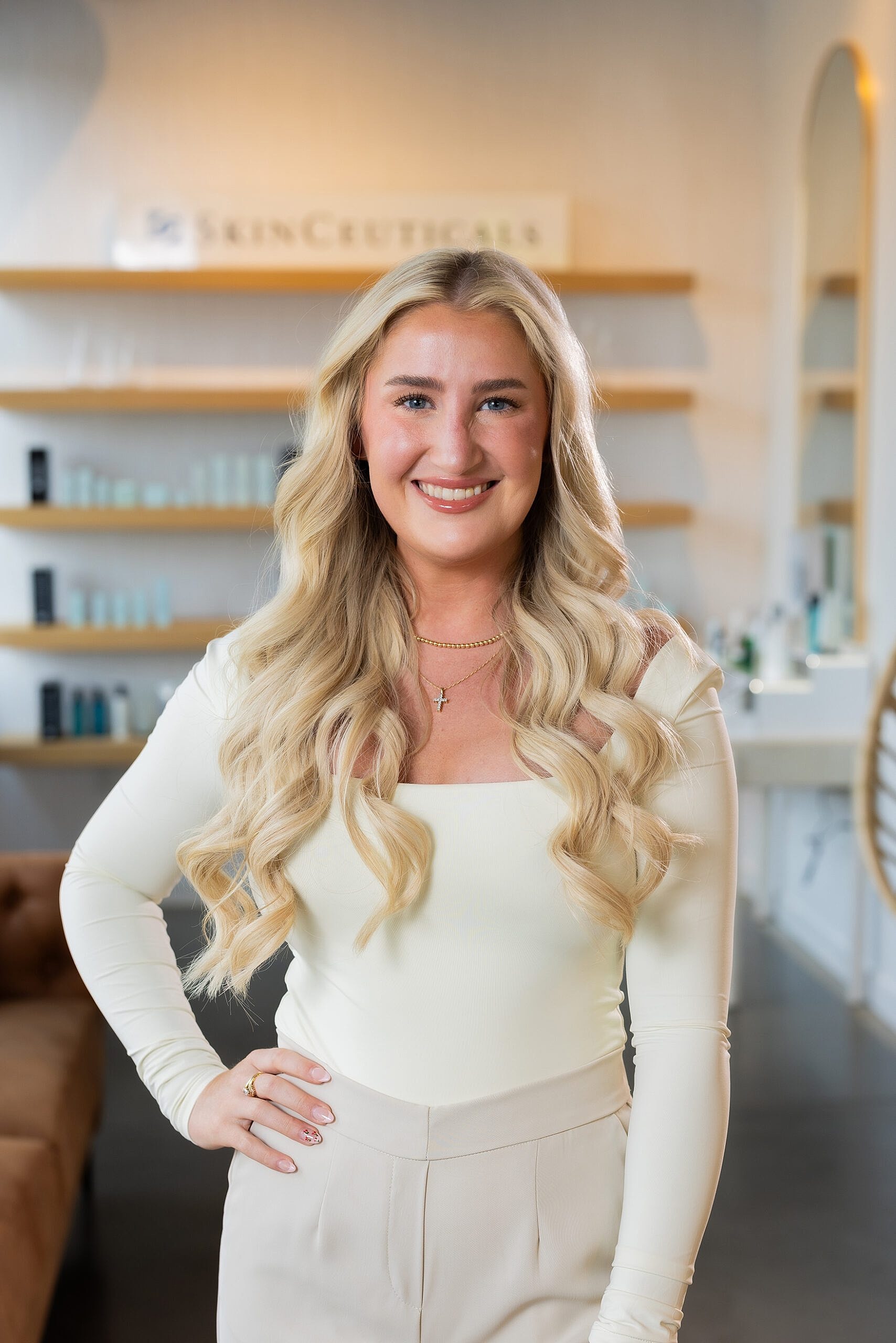 Smiling woman in a beauty salon setting.
